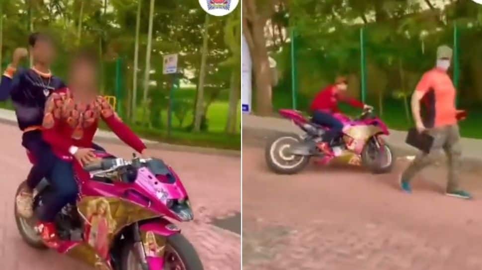 ‘Attention barbie girl’: Mumbai police shares video of two men performing dangerous stunt on bike- Watch what happens next