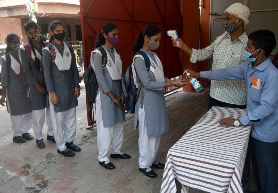 Students were checked with a thermal scanner before they entered the school