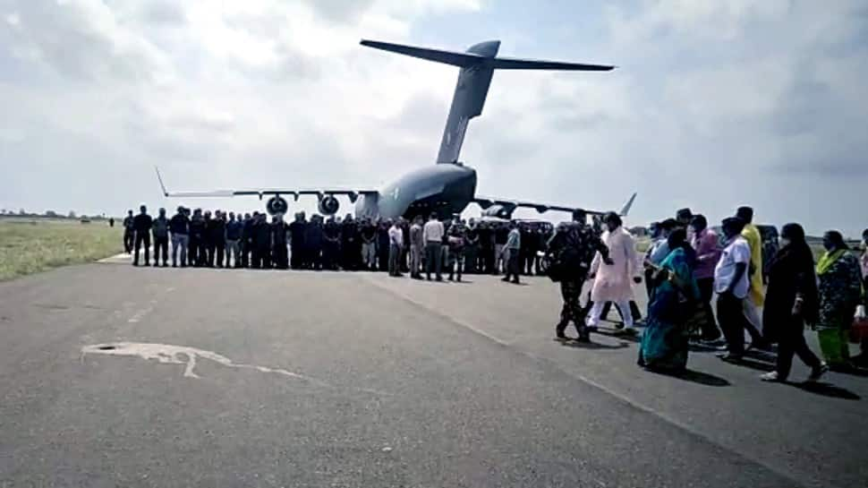 Fearful Afghans crowd Kabul airport to escape Taliban – In pics | News | Zee News