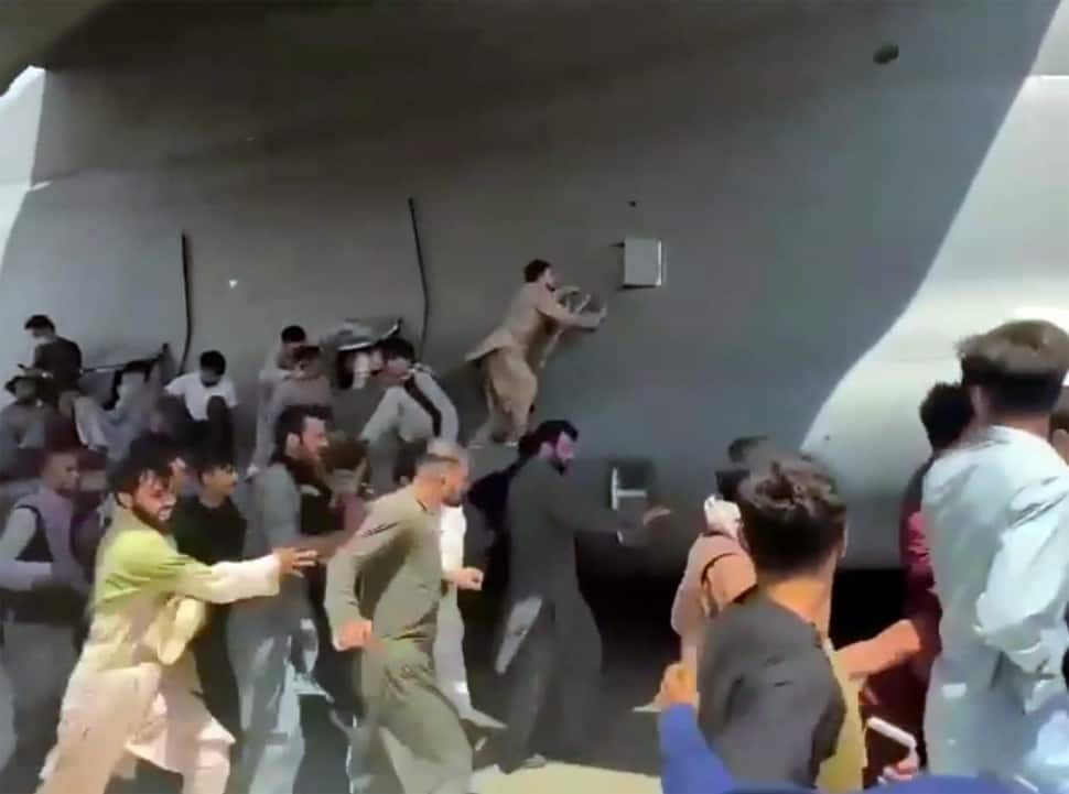 Afghans clinging to plane