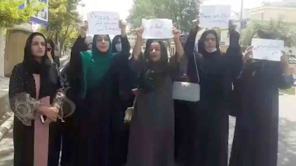 Afghan women hold street protest in front of Taliban fighters on Kabul