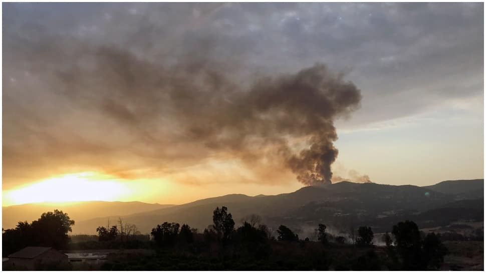 Thousands forced to flee as California wildfires turn dozens of homes into ashes