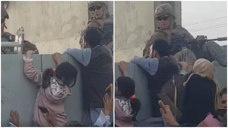 Desperate Afghan women throw babies over razor wire at Kabul airport compound, UK soldiers cry