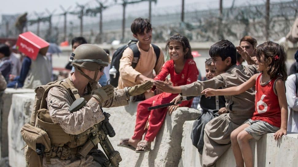 A wait for evacuation: US Marine plays with kids