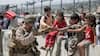 A wait for evacuation: US Marine plays with kids