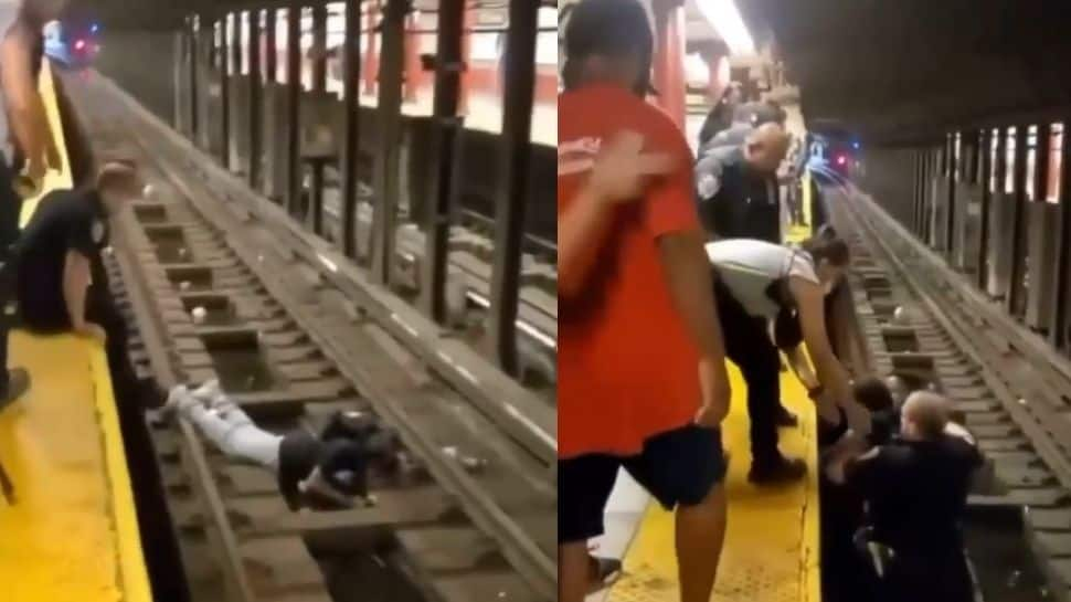 US cop, commuter scramble to save man who fell on subway tracks - Watch hair raising video