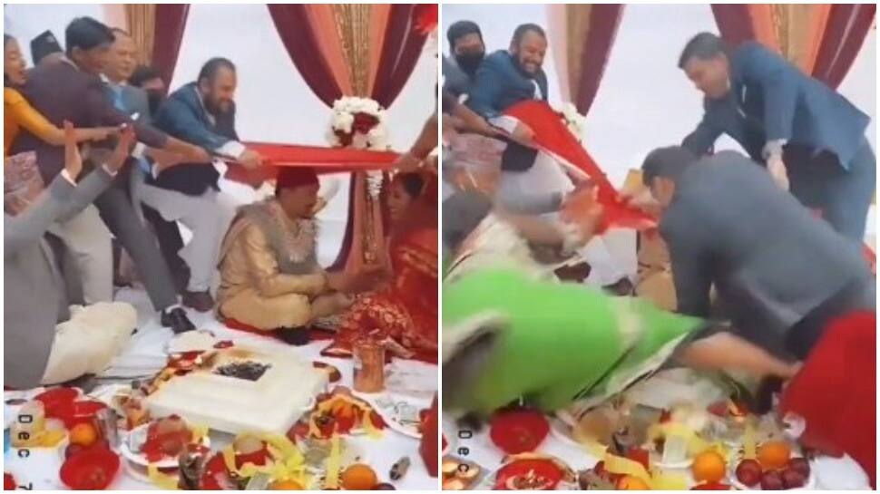 Tug of war at wedding mandap? Narrow escape for baraatis as bride and groom look shocked - Watch