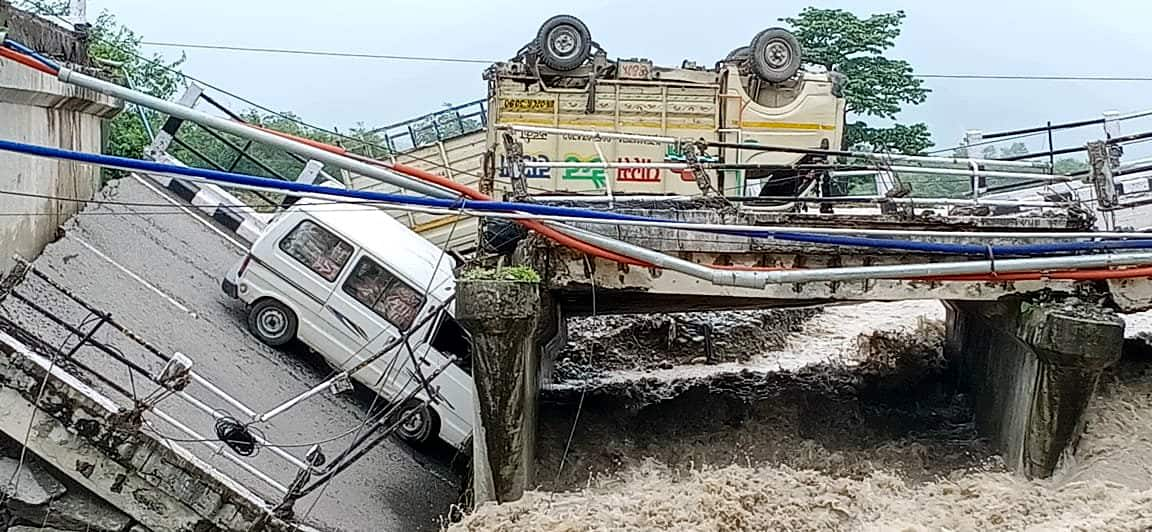 Vehicles engulfed as Pokhari bridge collapses