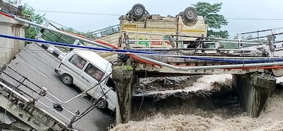 Vehicles engulfed as Pokhari bridge collapses