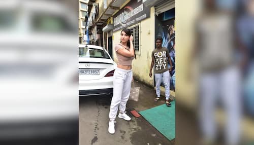 In pics: Nora Fatehi matches her nude colour crop top with a Louis