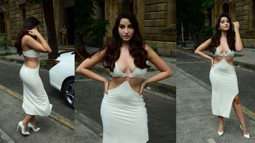 Nora Fatehi raises hotness bar in white bodycon dress with plunging  neckline! - In Pics | Bold dresses, White bodycon dress, White bodycon