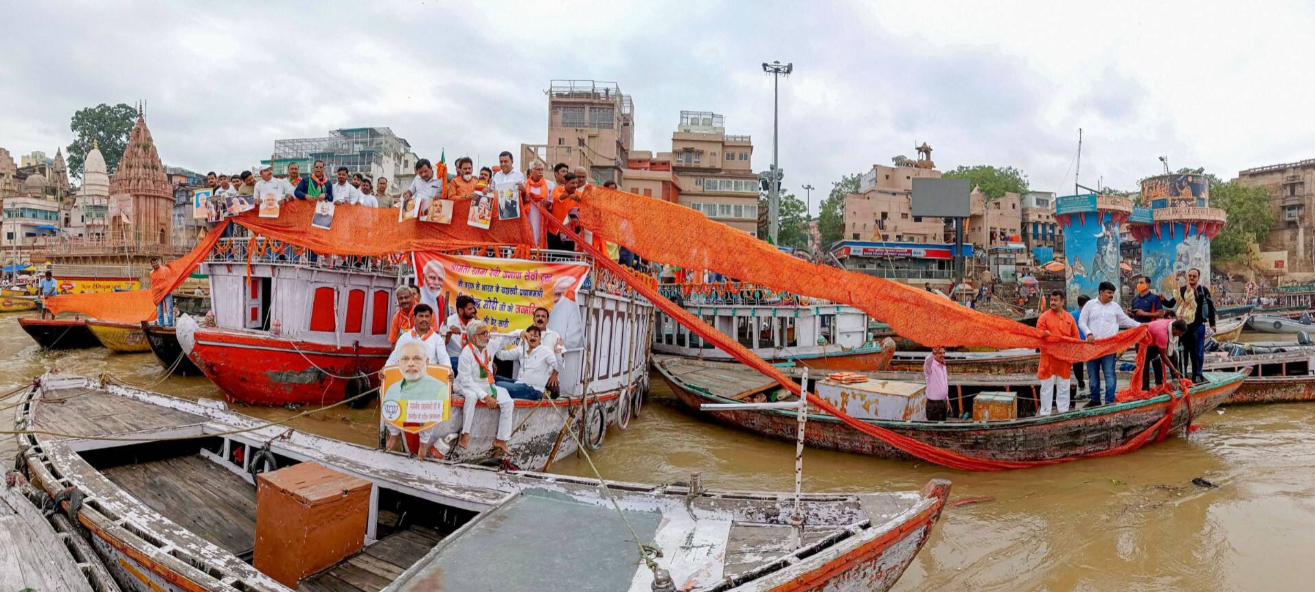 BJP supporters hold a 71-metre saree on the banks of Ganga