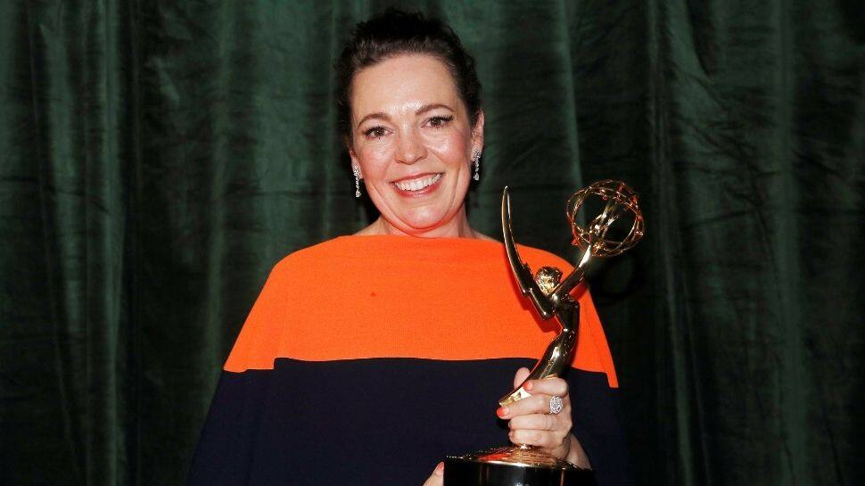 Olivia Colman poses with her Emmy award
