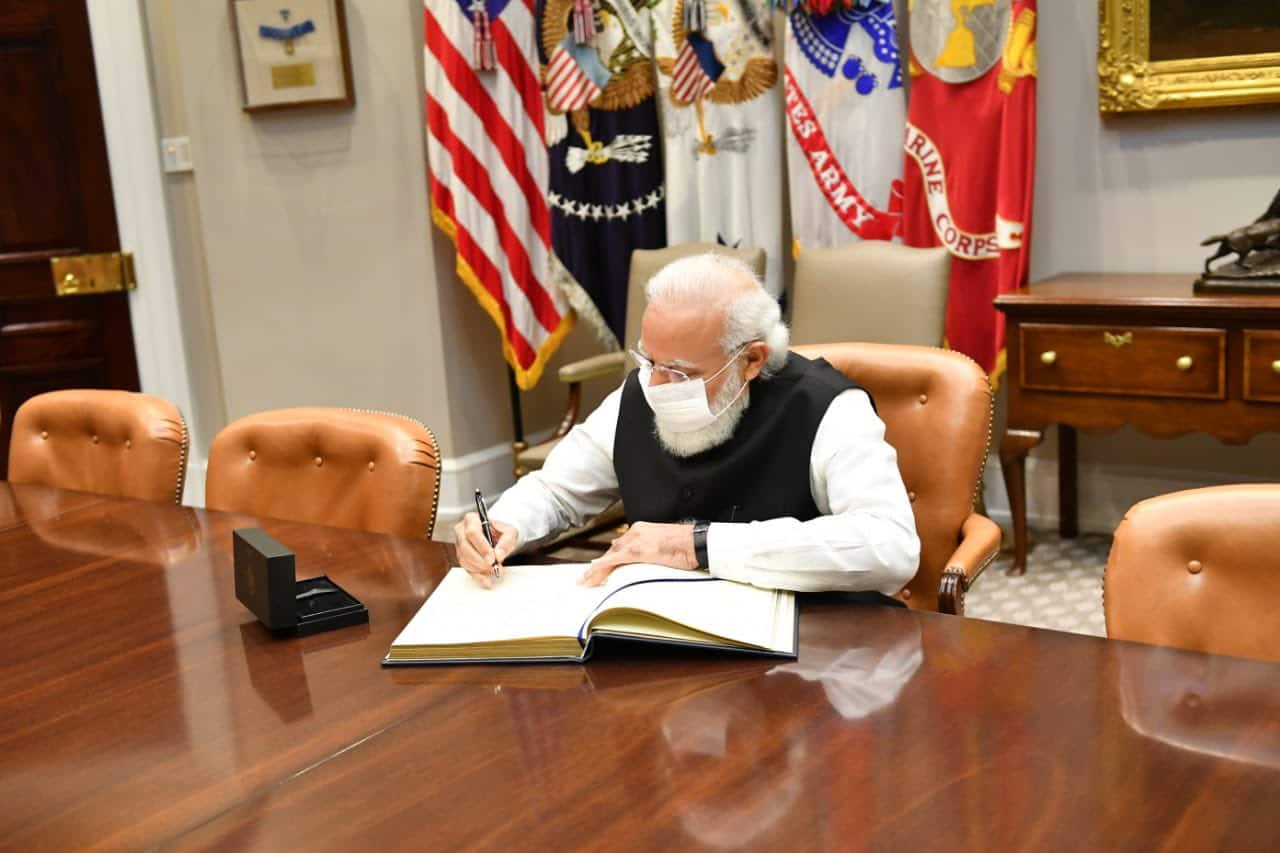 PM Modi signs visitor book in White House