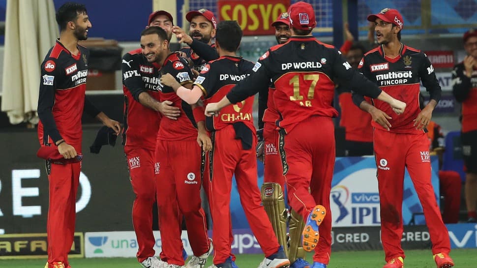 Royal Challengers Bangalore team congratulate Harshal Patel for completing a hat-trick against Mumbai Indians in their IPL 2021 match. (Photo: PTI)