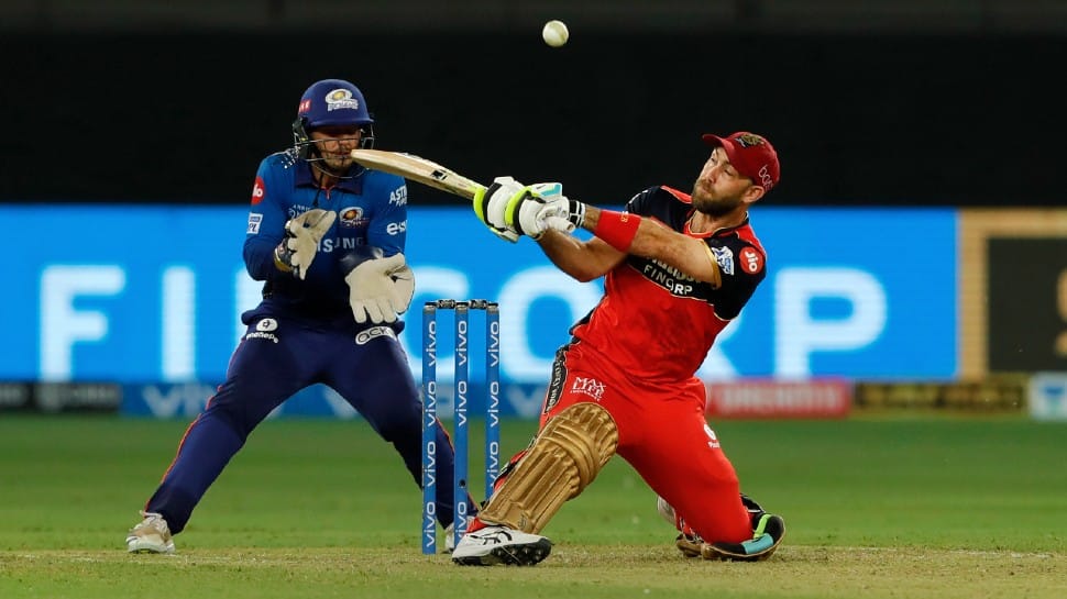 Royal Challengers Bangalore all-rounder Glenn Maxwell goes for a reverse sweep against Mumbai Indians in their IPL 2021 clash in Dubai. (Photo: PTI)