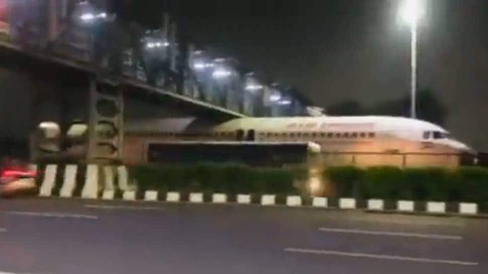 Air India plane gets stuck under foot over bridge near airport - WATCH