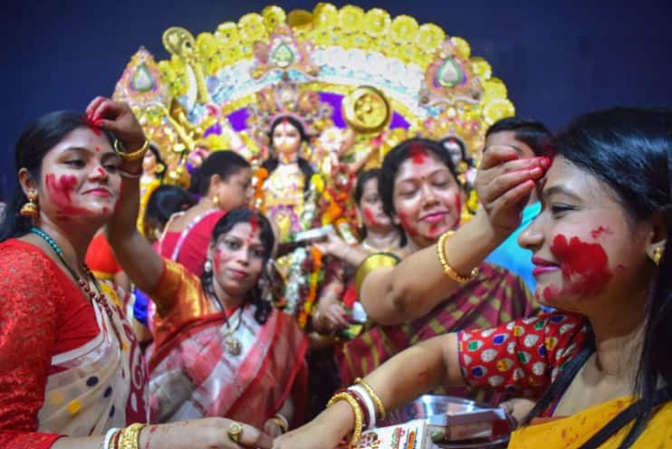 Women celebrate Dussehra with bright colours