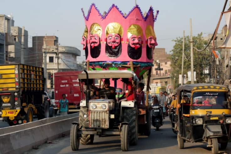 People carry effigies on a trolley