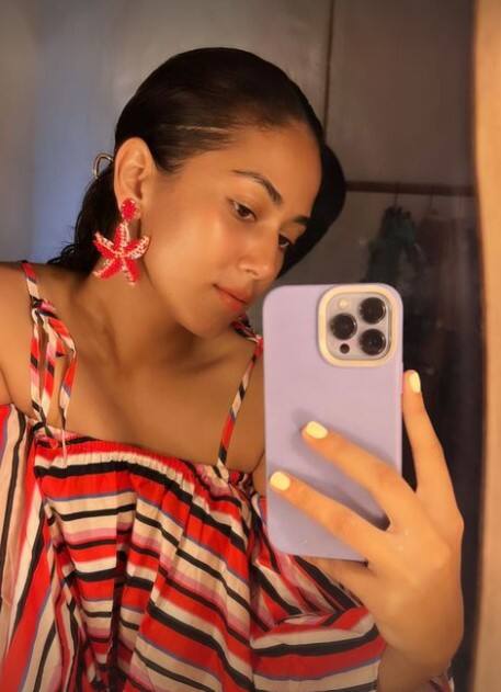 Notice Mira's starfish inspired earrings!