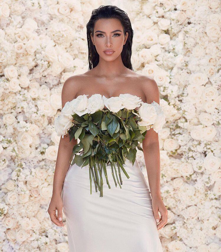 Kim Kardashian poses in a unique wedding gown