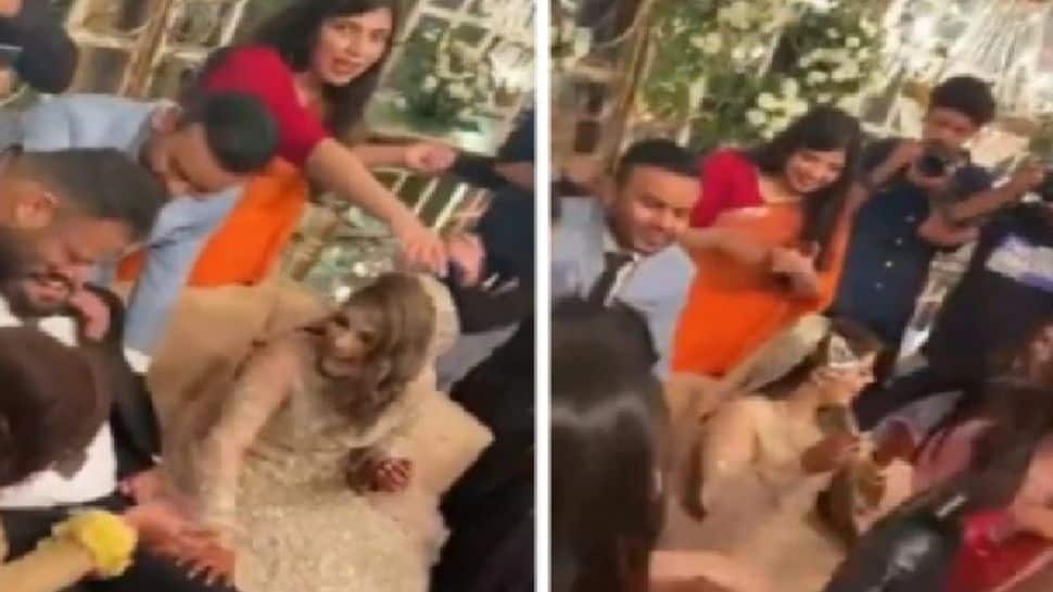 Sisters-in-law play THIS prank of  groom as bride looks amused, soon he&#039;s left with no shoes - Watch