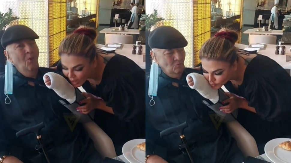 Rakhi Sawant gives a kiss to Prem Chopra&#039;s injured hand in viral video! - Watch