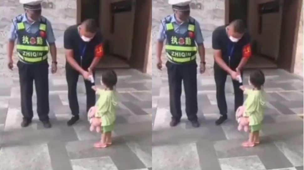 Little girl reminds guard to check her temperature in viral video, netizens applaud her ‘sense of duty’- Watch 