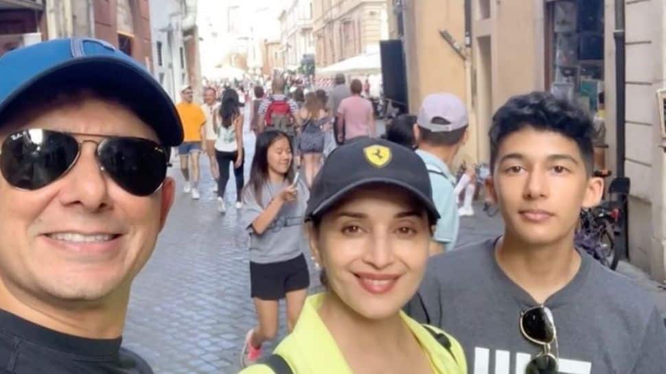 Madhuri Dixit poses with hubby Shriram and son Arin for a family photo in Italy!