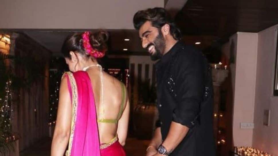 Arjun Kapoor's romantic glance at Malaika Arora from their unseen Diwali pic is everything!