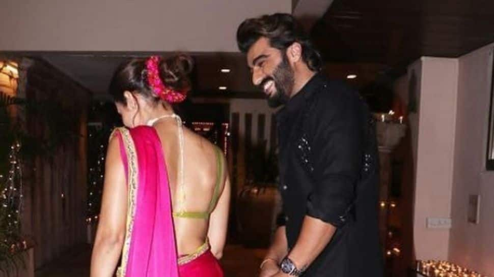 Arjun Kapoor&#039;s romantic glance at Malaika Arora from their unseen Diwali pic is everything!