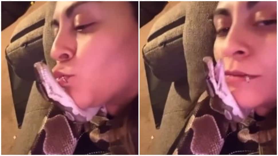 Bizarre! Woman cuddles with pet snake, leaves internet amazed- Watch