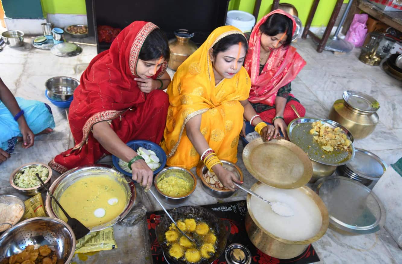 Devotees prepare holy food (Prasad) during 'Nahaye Khaye'