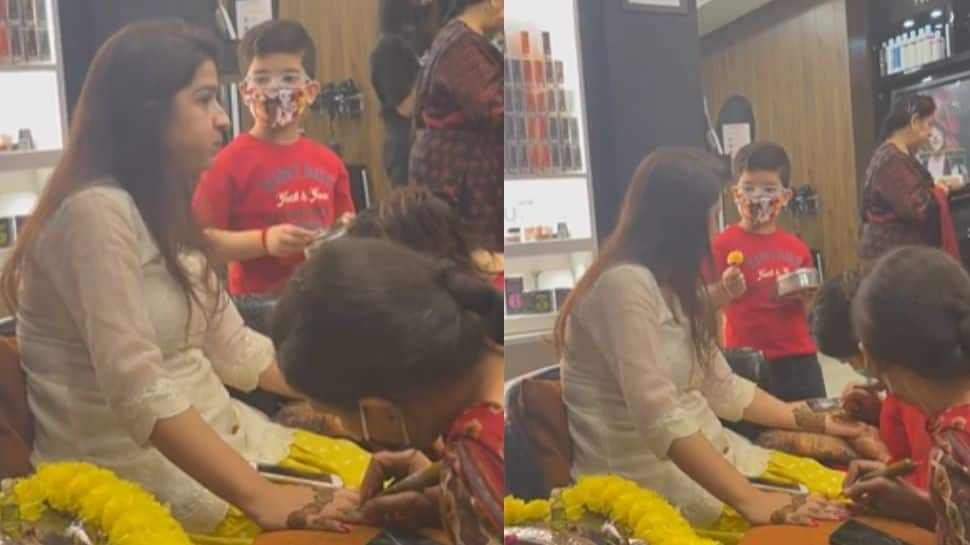 Child feeds his mom as she gets her mehendi done - watch adorable video here