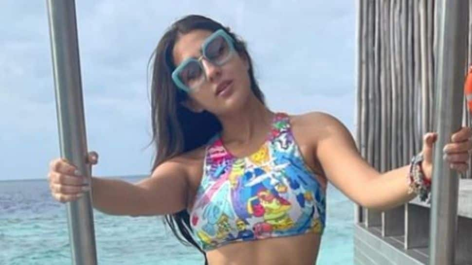 Sara Ali Khan dips in Maldives sea in quirky cartoon bikini, Radhika Madan goes &#039;Ufff&#039;