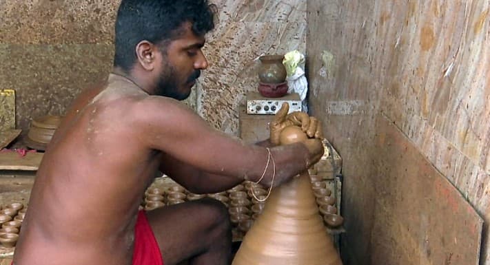 A beautiful earthen lamp crafted by a specially-abled potter