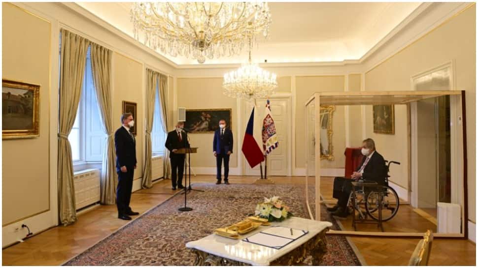 Covid positive Czech President Milos Zeman appoints new PM from inside a plexiglass cubicle