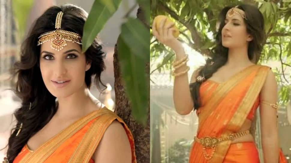 Katrina looks alluring in an orange bridal outfit