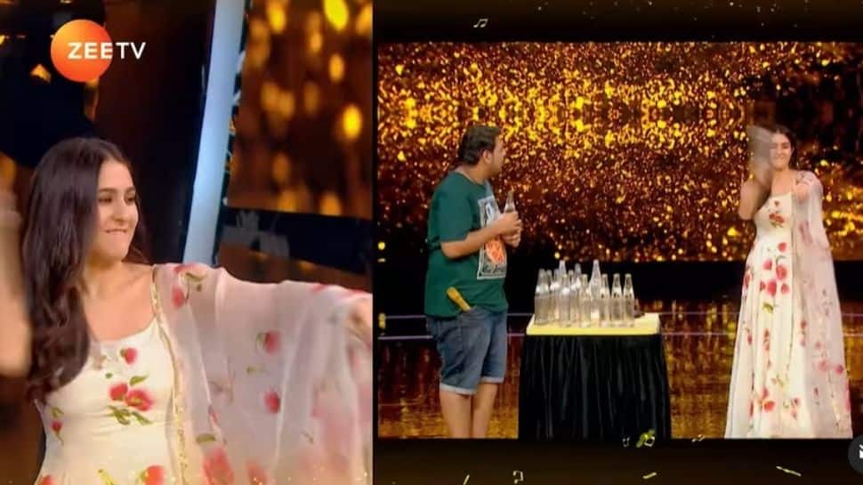 Sara Ali Khan smashes soda bottles with bare hands on 'Sa Re Ga Ma Pa' sets! Sara Ali Khan smashes soda bottles with bare hands on 'Sa Re Ga Ma Pa' sets!