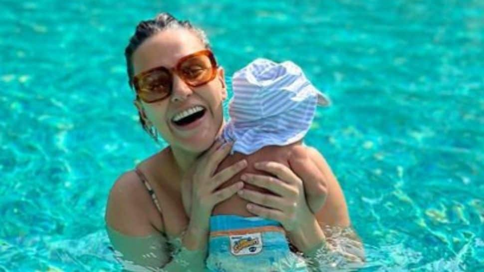 Angad Bedi, Neha Dhupia REVEAL their son&#039;s unique name, share family pool pic!