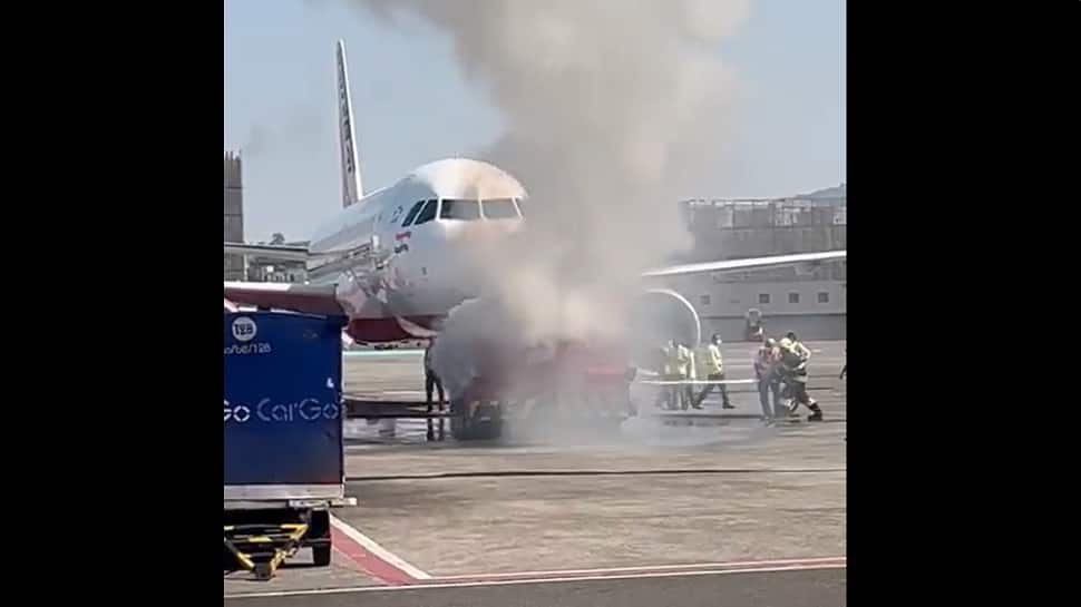 Watch: Pushback truck catches fire close to Air India plane, major mishap averted at Mumbai Airport