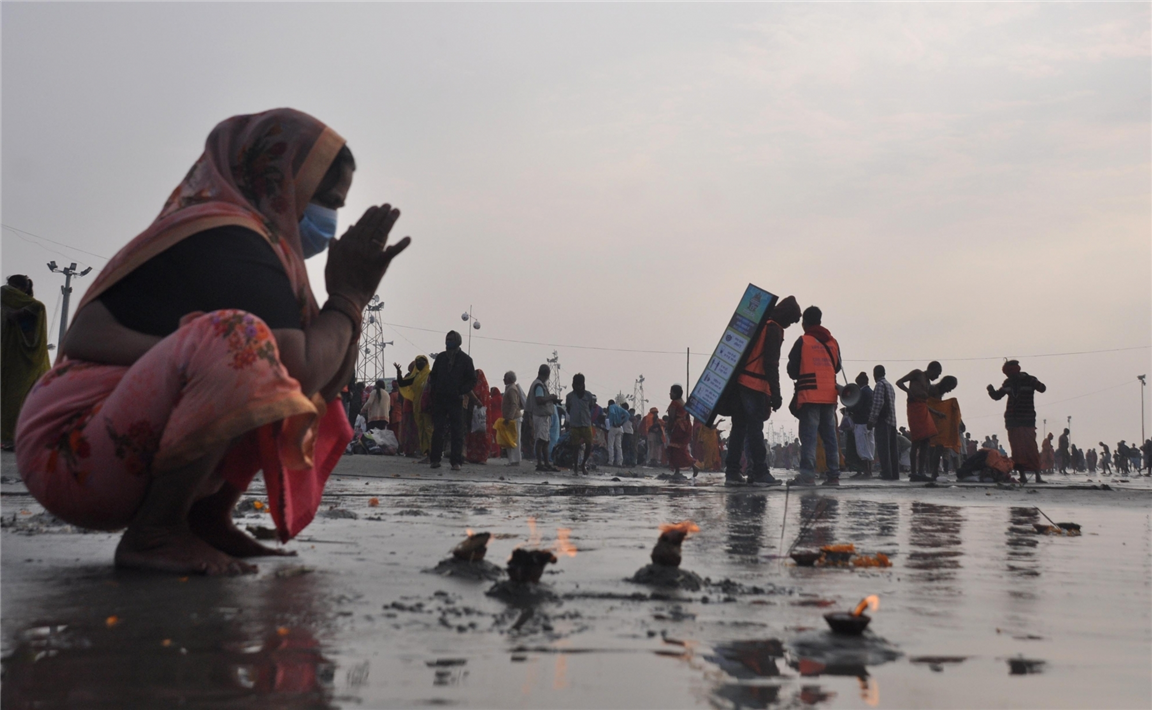 Devotee offers special prayer to Lord Surya at Gangasagar