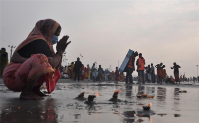 Devotee offers special prayer to Lord Surya at Gangasagar