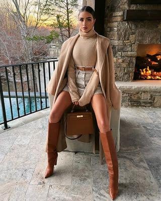 Olivia Culpo Goes Western in Lace Bralette & Boots at Evian's Club