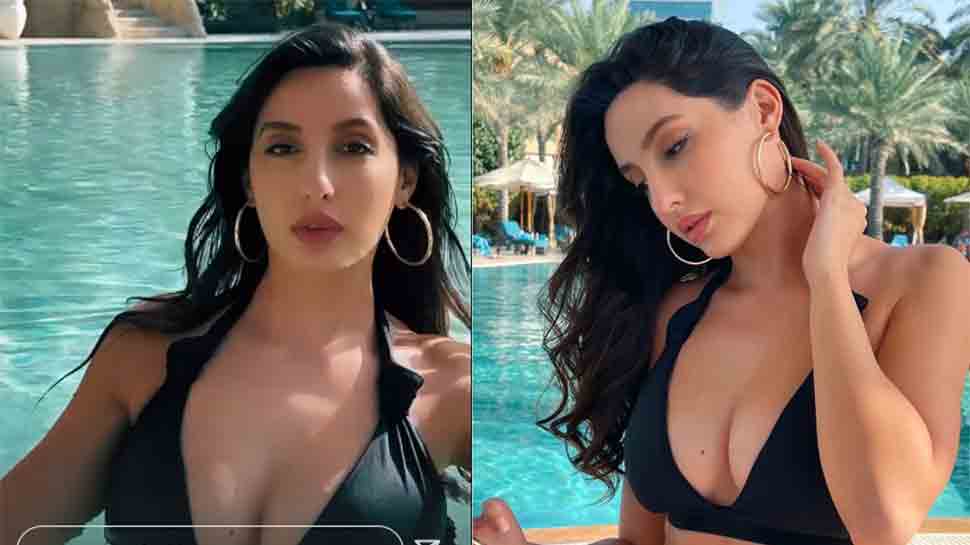 Dubai Ki Sexy Blue Film Sexy Original Video - Nora Fatehi drops photo in sexy black swimsuit as she takes dip in pool in  Dubai: WATCH | People News | Zee News