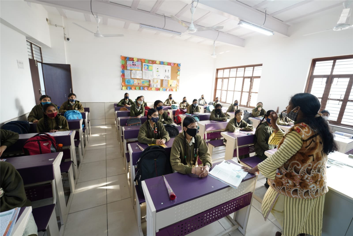 Students attend a class in Delhi