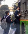 Students board a DTC bus in Delhi