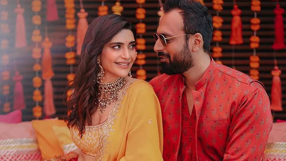 Newlyweds Karishma Tanna and Varun Bangera hold hands during bride&#039;s griha-pravesh ceremony - Watch