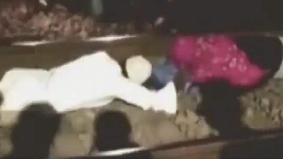 Watch: Man jumps under moving train to rescue a woman in Madhya Pradesh 
