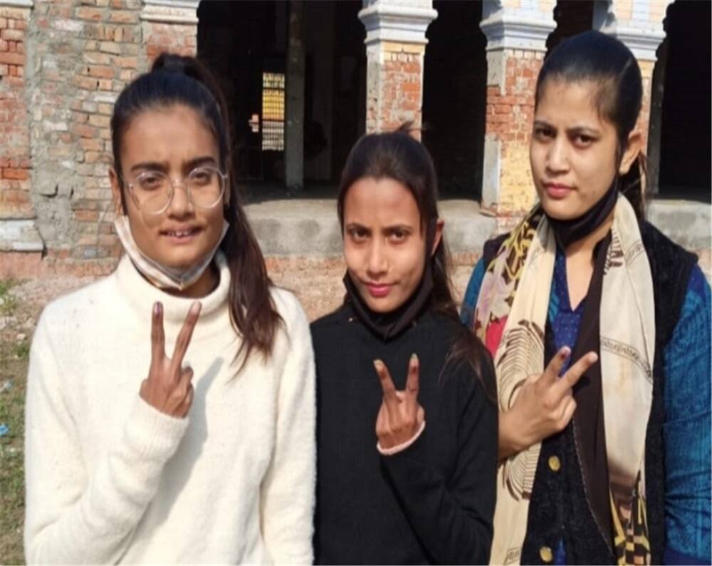 First-time voters showing inked fingers in Uttar Pardesh's Bijnor.